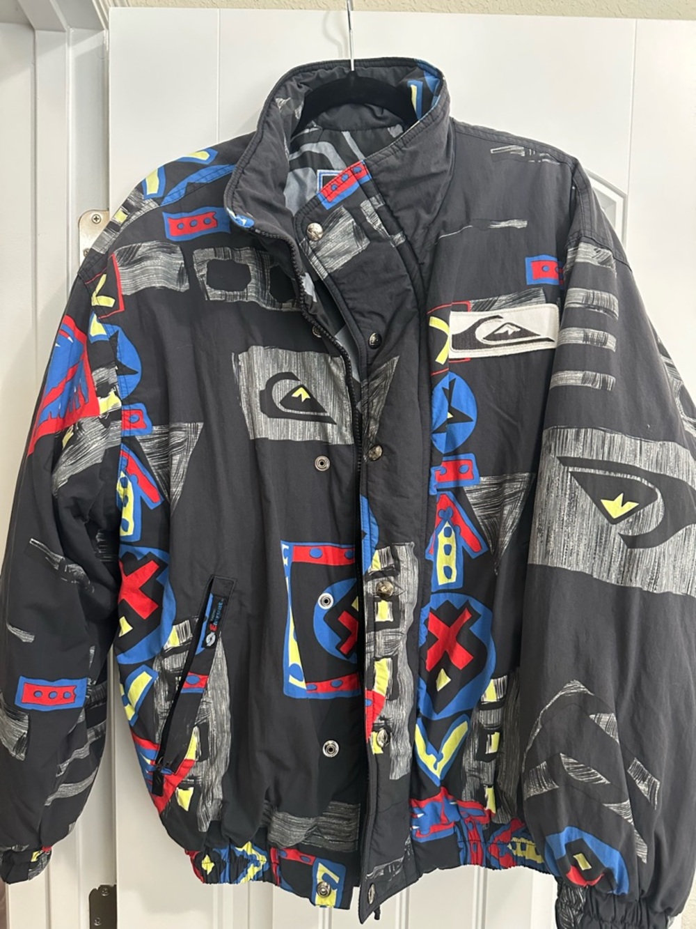 Quiksilver Black Ski Jacket with Red, Blue & Yellow Graphics